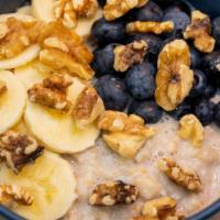 Banana Nut Oatmeal · topped with bananas, blueberries, walnuts and peanut butter