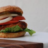 Zinger · Crispy chicken breast patty. Completed with lettuce, tomatoes, mayo and ketchup.