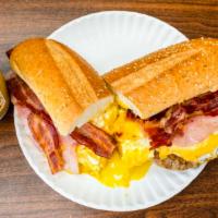 Hungry Man · Three eggs, ham, bacon, sausage, and cheese on a hero.