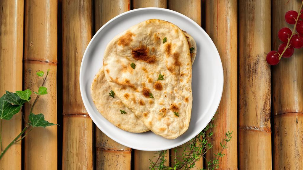 Naan For You · Freshly baked bread in a clay oven garnished with your choice of flavor.