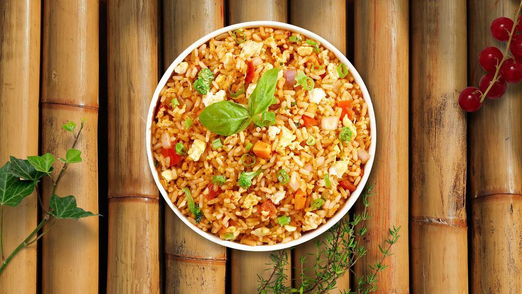 Indo Chinese Veg Fried Rice · Veggie fried rice tossed with carrot, peas, pepper, soy sauce and vinegar.