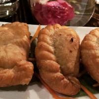 Curry Puff · Ground chicken, potatoes, onion and curry powder cooked in puff pastry with cucumber sauce.