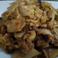 Drunken Noodle · Hot and spicy. Sauteed fresh flat noodles with your choice of protein, egg, tomatoes, onion,...