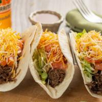 3 Ground Beef Tacos · Served with lettuce, tomatoes cheddar cheese
