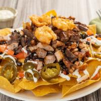 Plain Nachos · Homemade yellow corn tortilla chips covered with melted cheese, black beans, jalapeños, toma...