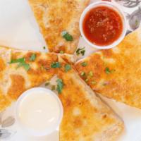 Chicken Quesadilla · Served with sour cream and salsa