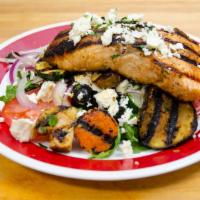 Large Grilled Salmon Salad · Grilled salmon over arugula salad with grilled vegetables: zucchini, carrots, mushrooms, egg...