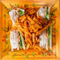 Turkey Club Sandwich · Served with lettuce, tomato, bacon & french fries. Choice of bread.