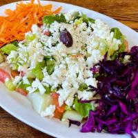 Mediterranean Salad · Vegetarian, gluten free. Fresh romaine lettuce, shredded carrots, red cabbage, tomatoes, cuc...