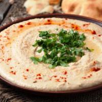 Hummus · Vegetarian, vegan. Chickpeas mashed into a paste with lemon juice, olive oil and flavored wi...