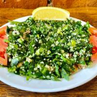 Tabbouleh · Bulgur mixed with chopped scallions, parsley, red bell peppers, tomatoes, and olive oil