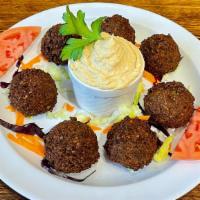 Falafel Appetizer · Chickpeas mashed with onions, parsley, garlic and deep-fried. Served with tahini sauce.