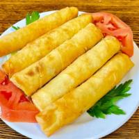 Feta Cheese Roll (5Pcs) · Delicate filo dough wrapped with feta cheese and parsley, deep-fried
