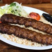 Lamb Adana Kebab · Ground lamb flavored with red bell peppers slightly seasoned with paprika and grilled delici...