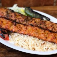 Chicken Adana · Chicken grilled on skewers chicken flavored with red bell peppers, gently spiced with paprik...