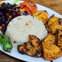 Chicken Shish Kebab · Tender chunks of chicken marinated with chefs' own blend of herbs & spices