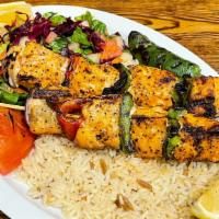 Salmon On Skewers · Cubes of chargrilled salmon served with salad and rice