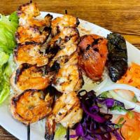Shrimp Kebab · Char-grilled jumbo shrimps served with salad and rice