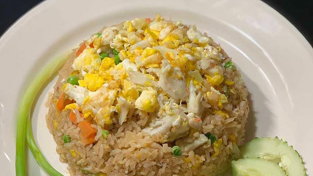 Crab Fried Rice · Lump real crab meat and stir-fried rice with egg, butter, peas, carrot, onion, scallion.