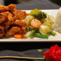 Volcano Crispy Chicken · Crispy chicken or tofu or shrimp sautéed graze with sweet chili sauce and season vegetable.