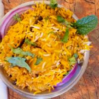 Vegetable Biryani · Rice cooked with yogurt and mélange of fresh curried vegetables, mint and coriander leaves.