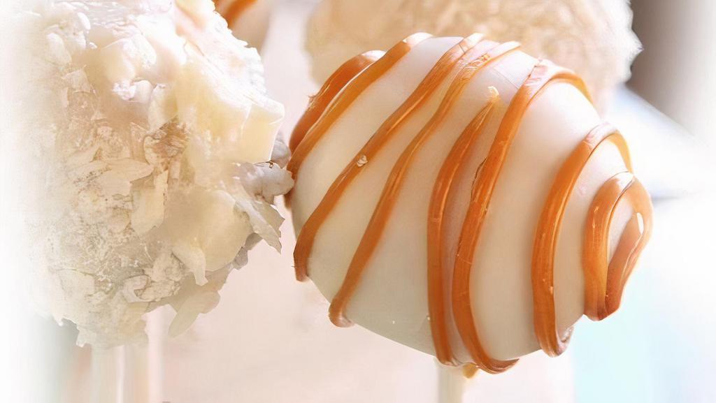 Handmade Caramel Cake Pop · Caramel cheesecake flavored cake pops dipped in white chocolate and topped with homemade caramel sauce!