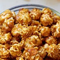 Caramel Popcorn · Caramel corn or caramel popcorn is a confection made of popcorn coated with a sugar or molas...