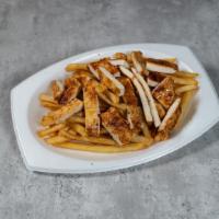 Tiritas De Pollo / Chicken Tenders · Chicken strips and french fries.