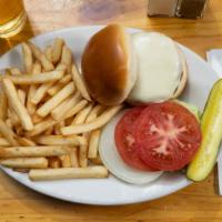 Beef Burger · Served with a pickle and side of fries.