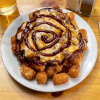 Pulled Pork Tots · Topped with pulled pork, melted cheddar/mozzarella with BBQ sauce.