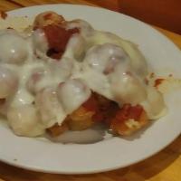 Pizza Tots · Drizzled with marinara sauce topped with melted mozzarella.