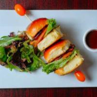 Jerk Chicken Sliders · Grilled chicken breast marinated in jerk seasoning and assembled with lettuce and tomato on ...