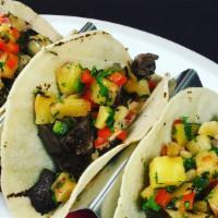 Wagyu Skirt Steak Tacos (3) · Soft Corn Tortillas, Roasted Pineapple Pico de Gallo and spicy mayo.