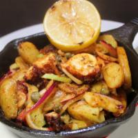 Grilled Octopus · Roasted Potatoes With Paprika Oil, Red Onions, Celery, Capers, Lemon Vinaigrette