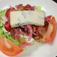 Imc Wedge Salad · Iceberg lettuce, double smoked bacon, heirloom tomato and homemade bleu cheese dressing.