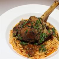 Lamb Shank · Orzo pasta, tomato compote, rosemary red wine reduction.