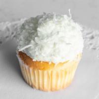 Coconut Snowball · A vanilla cupcake topped with vanilla buttercream and rolled in flaky coconut.