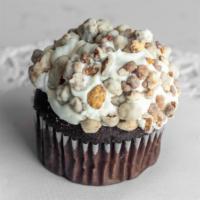 S'Mores · A chocolate cupcake topped with a marshmallow buttercream frosting, dipped in chocolate gana...