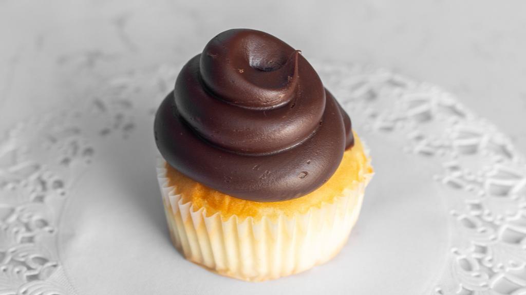 Boston Cream Pie · A vanilla cupcake filled with classic Bavarian cream, topped with chocolate ganache.