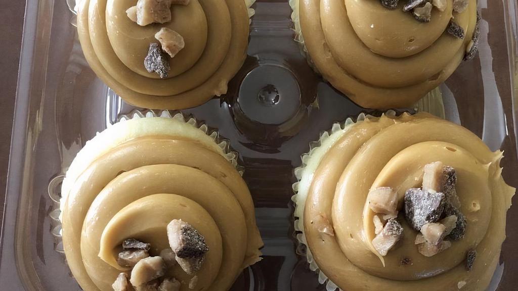 Dulce De Leche · Moist vanilla cake filled with dulce de leche cream, then topped with a caramel buttercream frosting, and a toffee crunch.