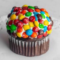 Candy Cup · Chocolate cupcake topped with vanilla buttercream and rolled in mini M&M's.