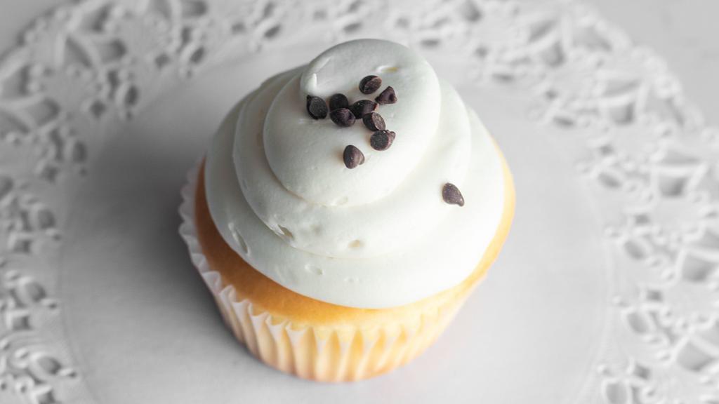 Gluten-Free Vanilla · Gluten-free vanilla cupcake topped with vanilla buttercream and topped with mini chocolate chips.