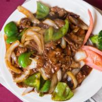Pepper Steak · Sliced pieces of beef sautéed with green peppers in a savory brown sauce.