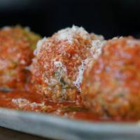Meatballs · Tomato sauce, basil, and Parmesan cheese.