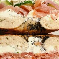 Smoked Salmon Bagel · Acme smoked salmon, homemade scallion herb cream cheese, pickled red onions, fresh cucumber,...