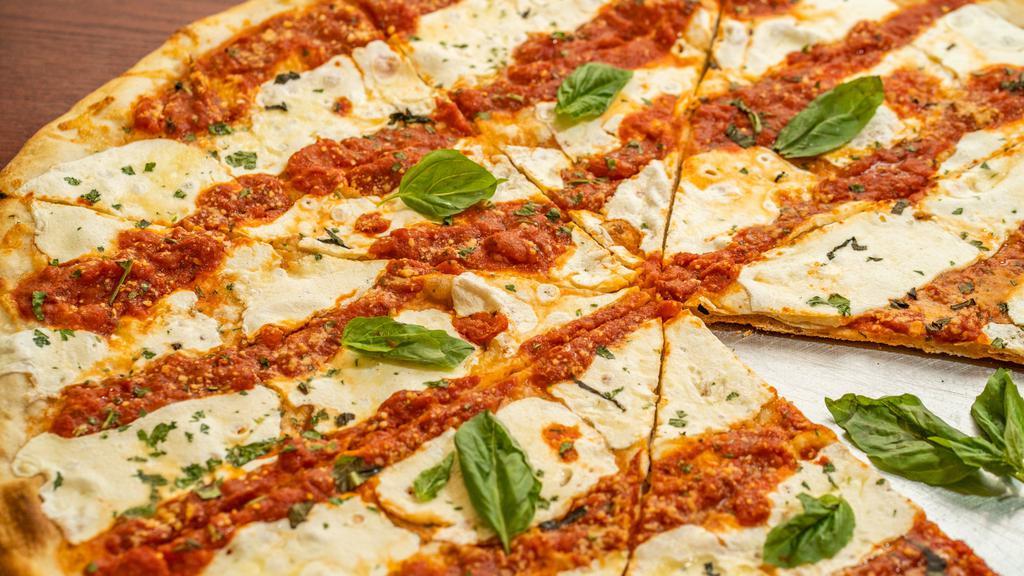 Margherita Pizza Pie · Our signature slice from our old family recipe. Thin crust with fresh mozzarella, homemade marinara sauce, the finest Parmesan, and fresh basil.