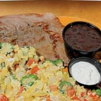 Mexican Breakfast · Scrambled eggs with tomato, onions & jalapeño peppers. served with steak, beans, sweet plant...