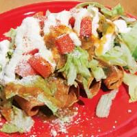 Flautas · 5 rolled chicken taquitos topped with lettuce, pico de gallo, cheese & sour cream.