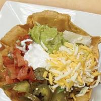 Azteca Crispy Salad · Crispy Flour Tortilla Bowl. Served with your choice of meat. (Grilled or Sautéed), rice, bea...