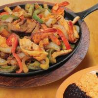 Fajitas · Sautéed onions and peppers with Tender Slices of your meat of your choice. Served with rice,...